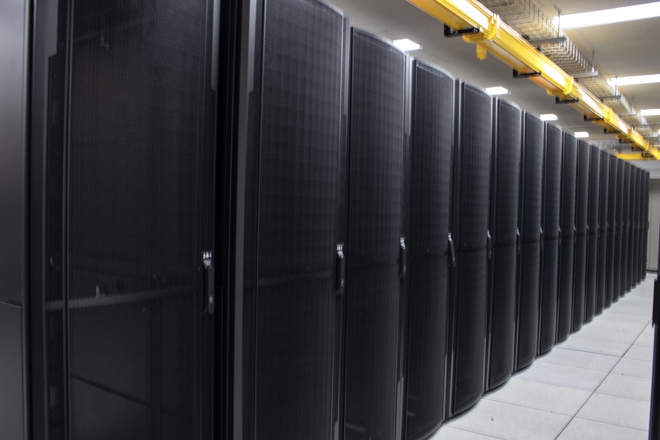 Inside Epsilon Data Centre, with a row of equipment racks and overhead cable trays